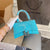 Crocodile print hourglass bag