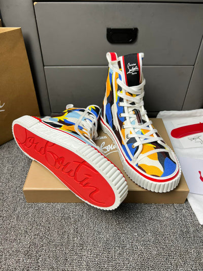 Loubouti'* latest red-soled canvas shoes