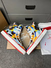 Loubouti'* latest red-soled canvas shoes